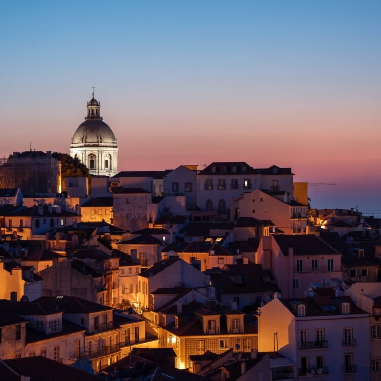 Lisbon cityscape at dusk with Church of Santa Engrácia dome and glowing rooftops – fine art print