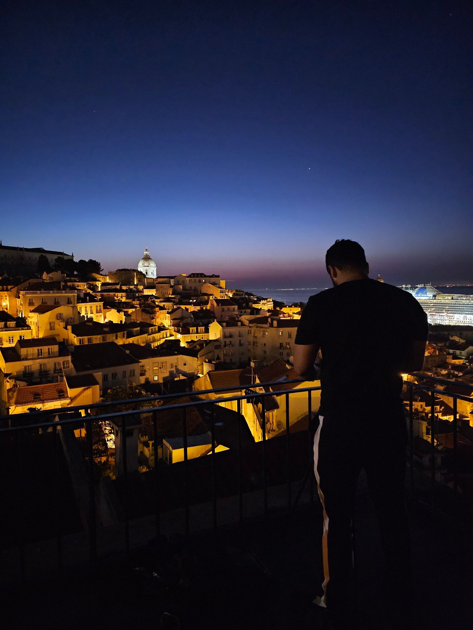Photographer Arjun Maher capturing sunrise over Alfama Lisbon